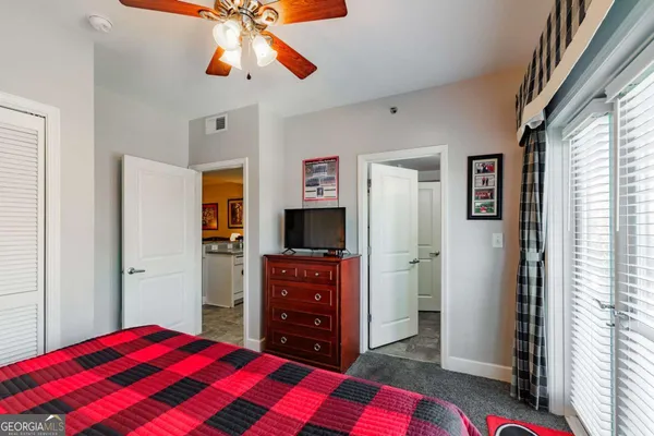 a bedroom with a bed and a dresser