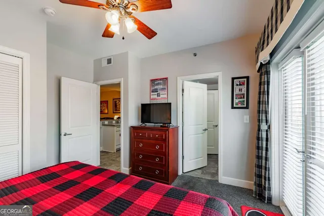 a bedroom with a bed and a dresser