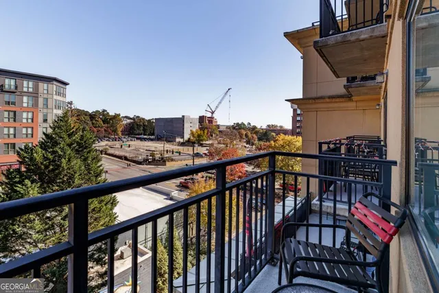 a view of balcony with furniture