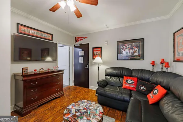 a living room with furniture and a flat screen tv