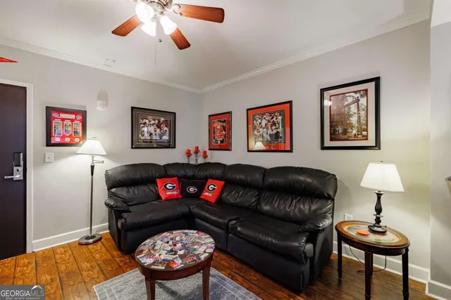 a living room with furniture a lamp and a window