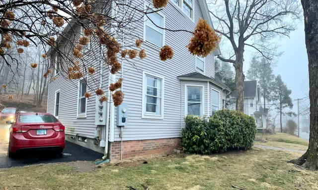 a view of a house with a back yard