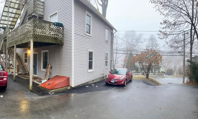 a car parked in front of a house