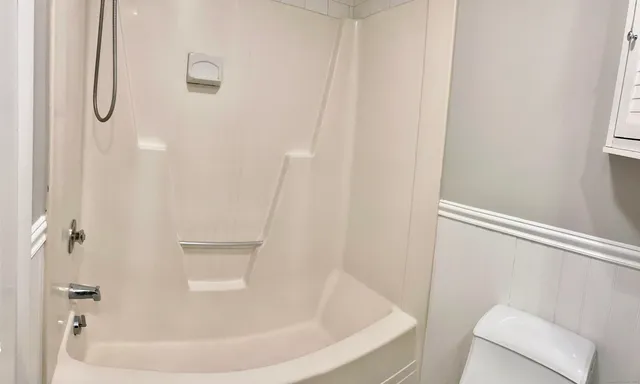 a bathroom with a white bath tub