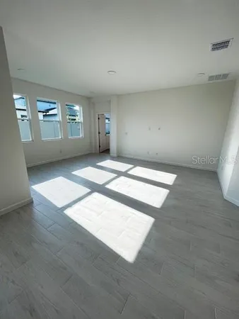 an empty room with windows