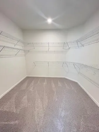 a bathroom with a double vanity sink mirror and toilet