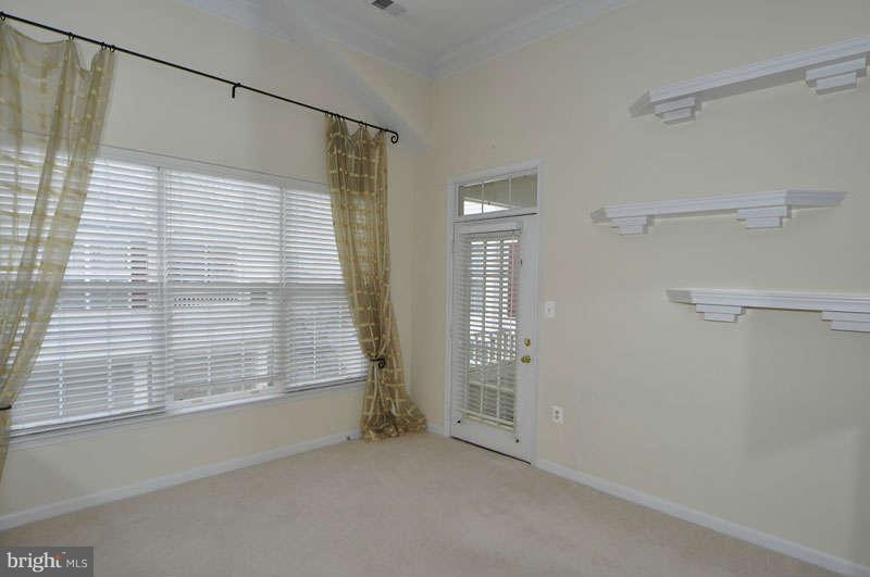11408 Gate Hill Place, Unit O Reston, VA 20194 - Photo 11 of 30 a view of an empty room with a window