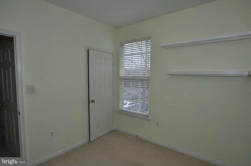 11408 Gate Hill Place, Unit O Reston, VA 20194 - Photo 18 of 30 a view of an empty room with a window