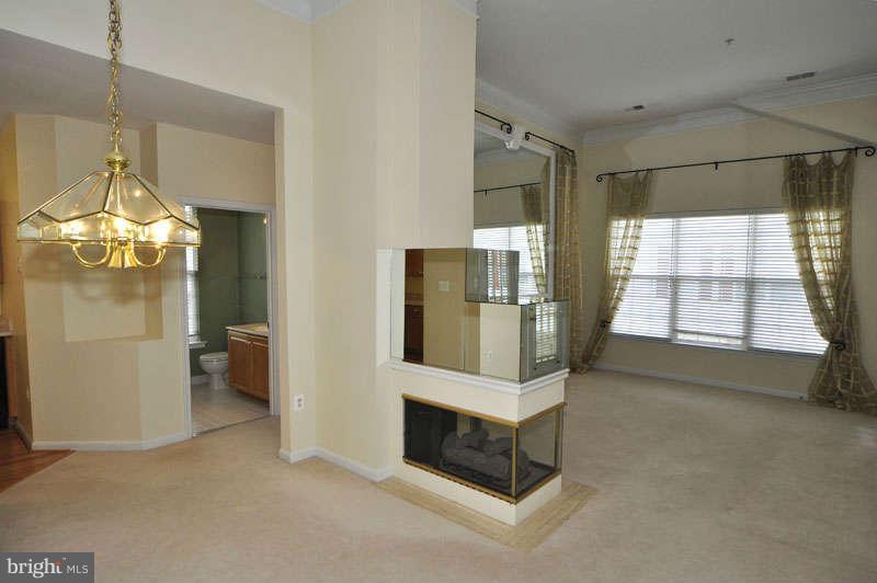11408 Gate Hill Place, Unit O Reston, VA 20194 - Photo 6 of 30 a living room with furniture and a fireplace
