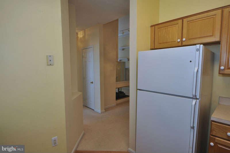 11408 Gate Hill Place, Unit O Reston, VA 20194 - Photo 9 of 30 a white refrigerator freezer freezer sitting in a kitchen