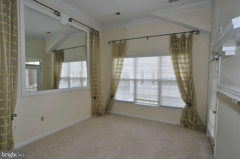 11408 Gate Hill Place, Unit O Reston, VA 20194 - Photo 10 of 30 a view of an empty room with a window
