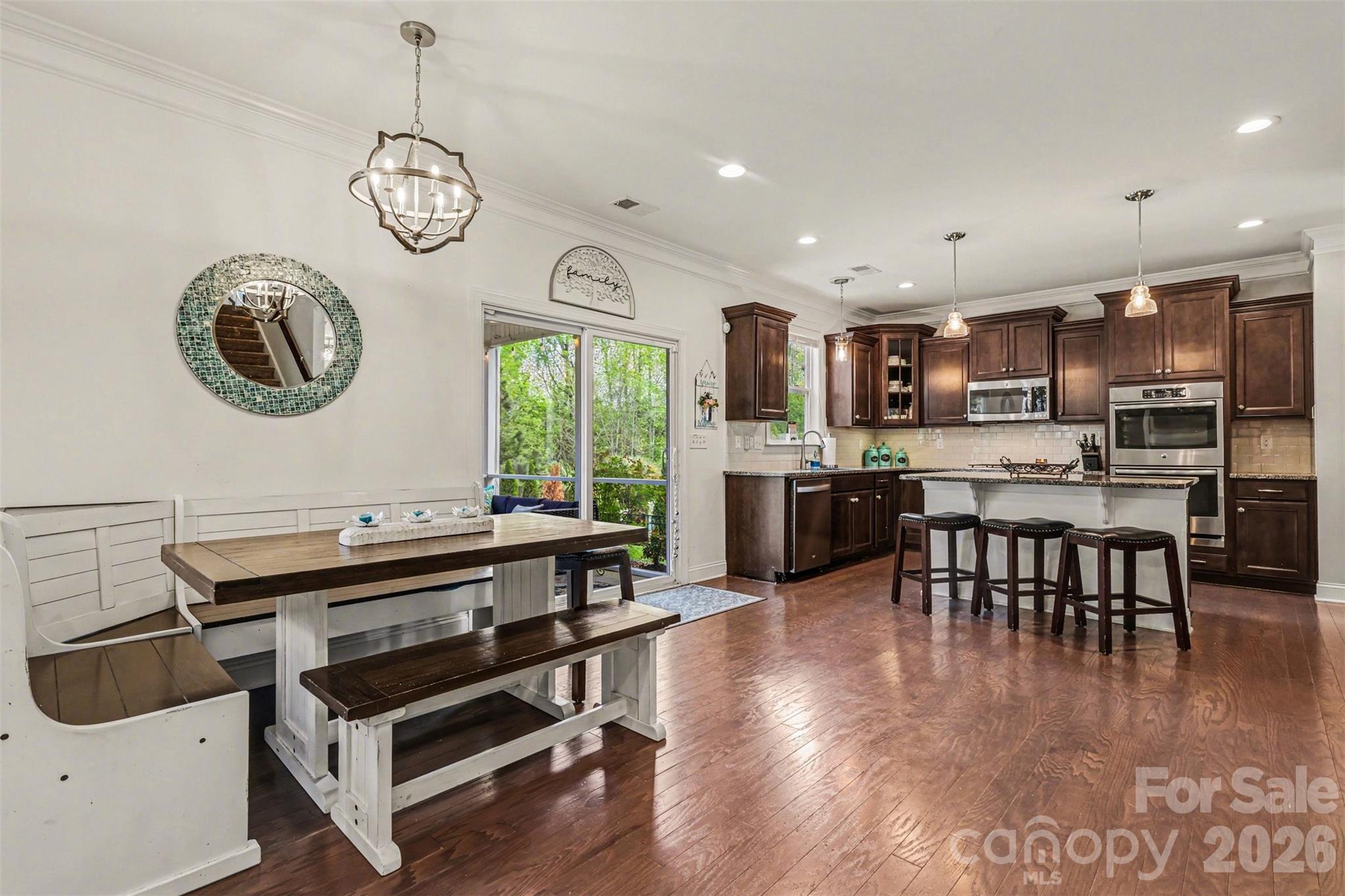850 Coralbell Way Fort Mill, SC 29708 - Photo 11 of 48 a large kitchen with a table and chairs in it