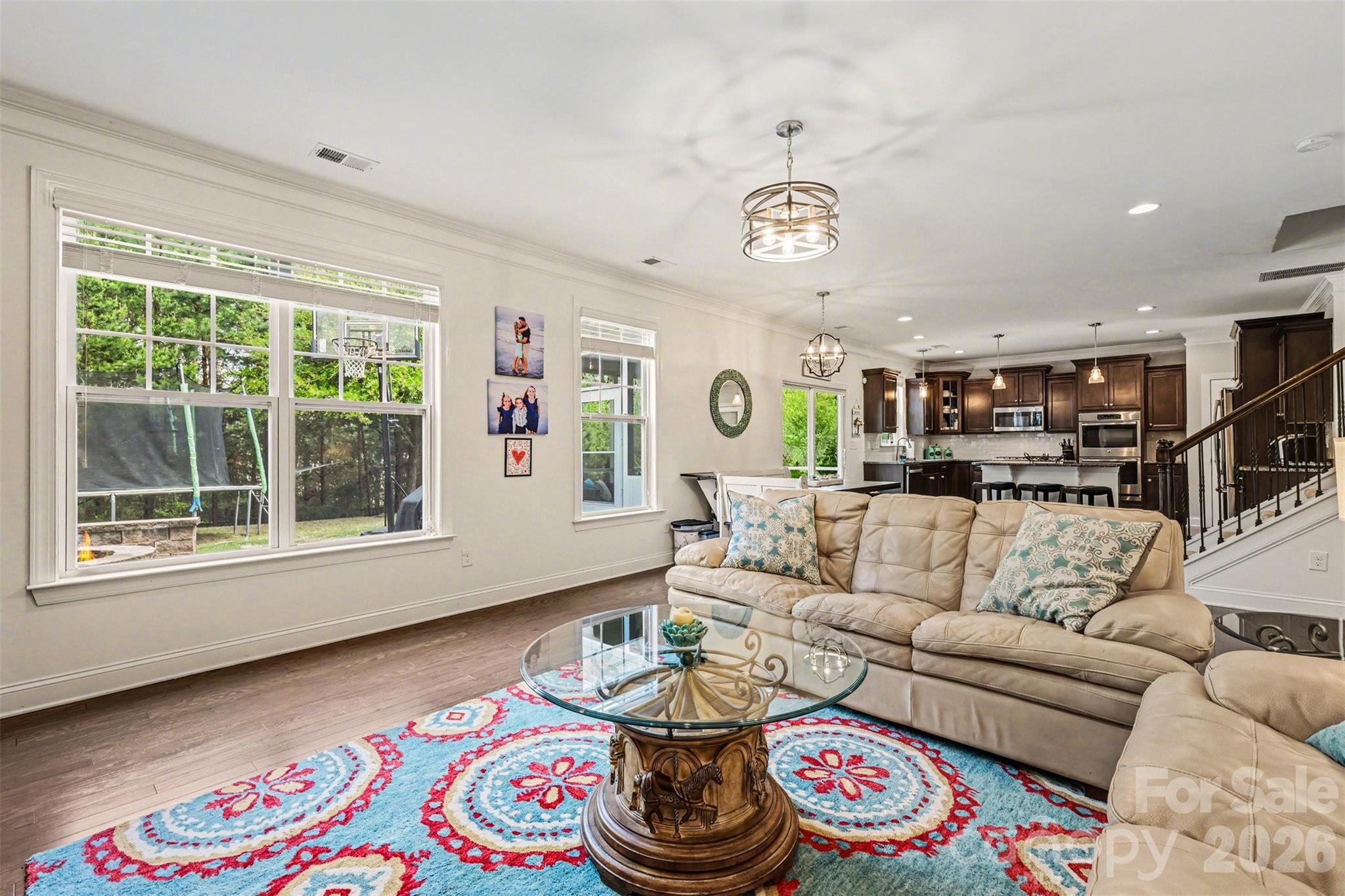850 Coralbell Way Fort Mill, SC 29708 - Photo 13 of 48 a living room with furniture and a large window