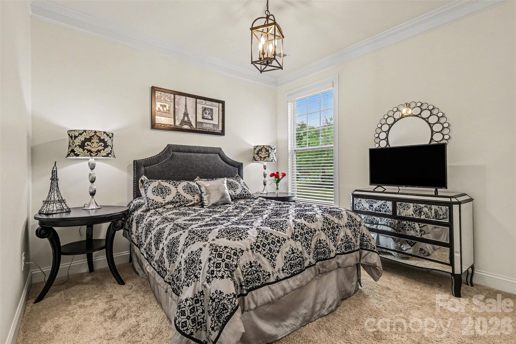 850 Coralbell Way Fort Mill, SC 29708 - Photo 16 of 48 a bedroom with a bed and a flat screen tv