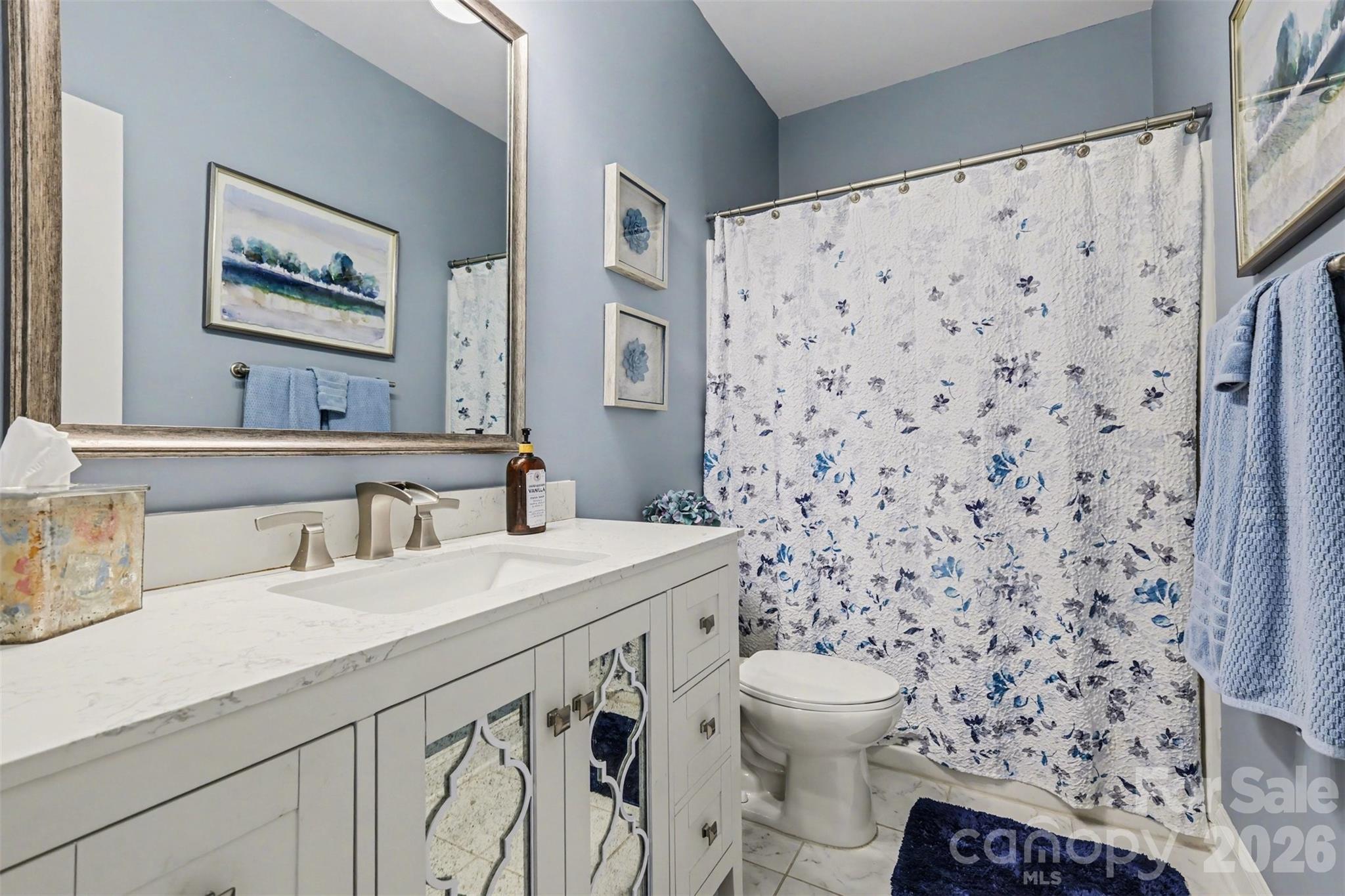 850 Coralbell Way Fort Mill, SC 29708 - Photo 17 of 48 a bathroom with a sink toilet and shower