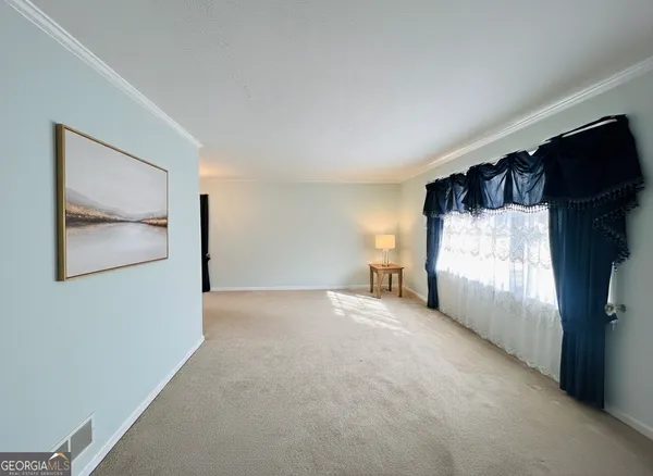 a view of a room with a flat screen tv