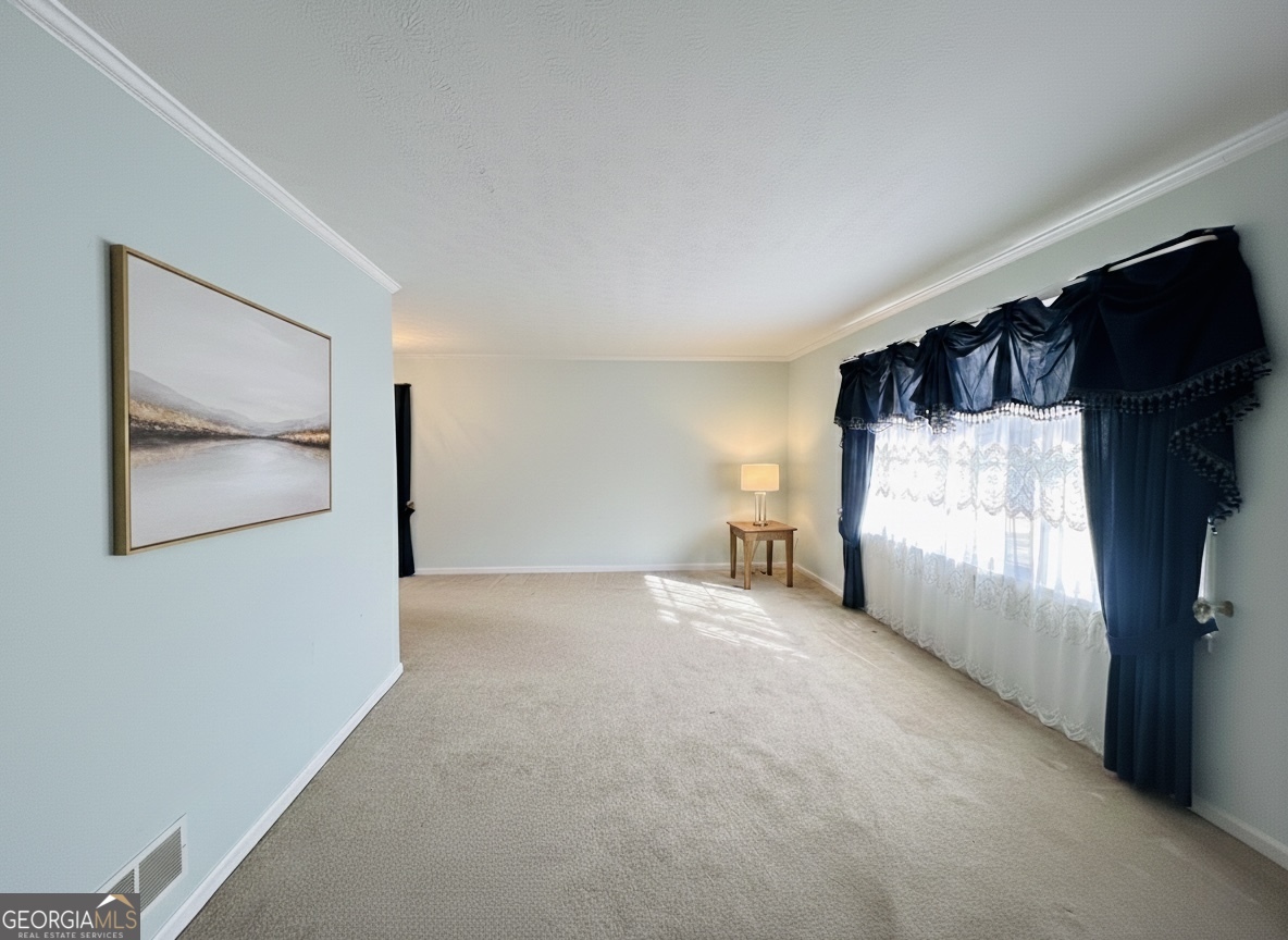 211 Clark Road Griffin, GA 30224 - Photo 13 of 25 a view of a room with a flat screen tv