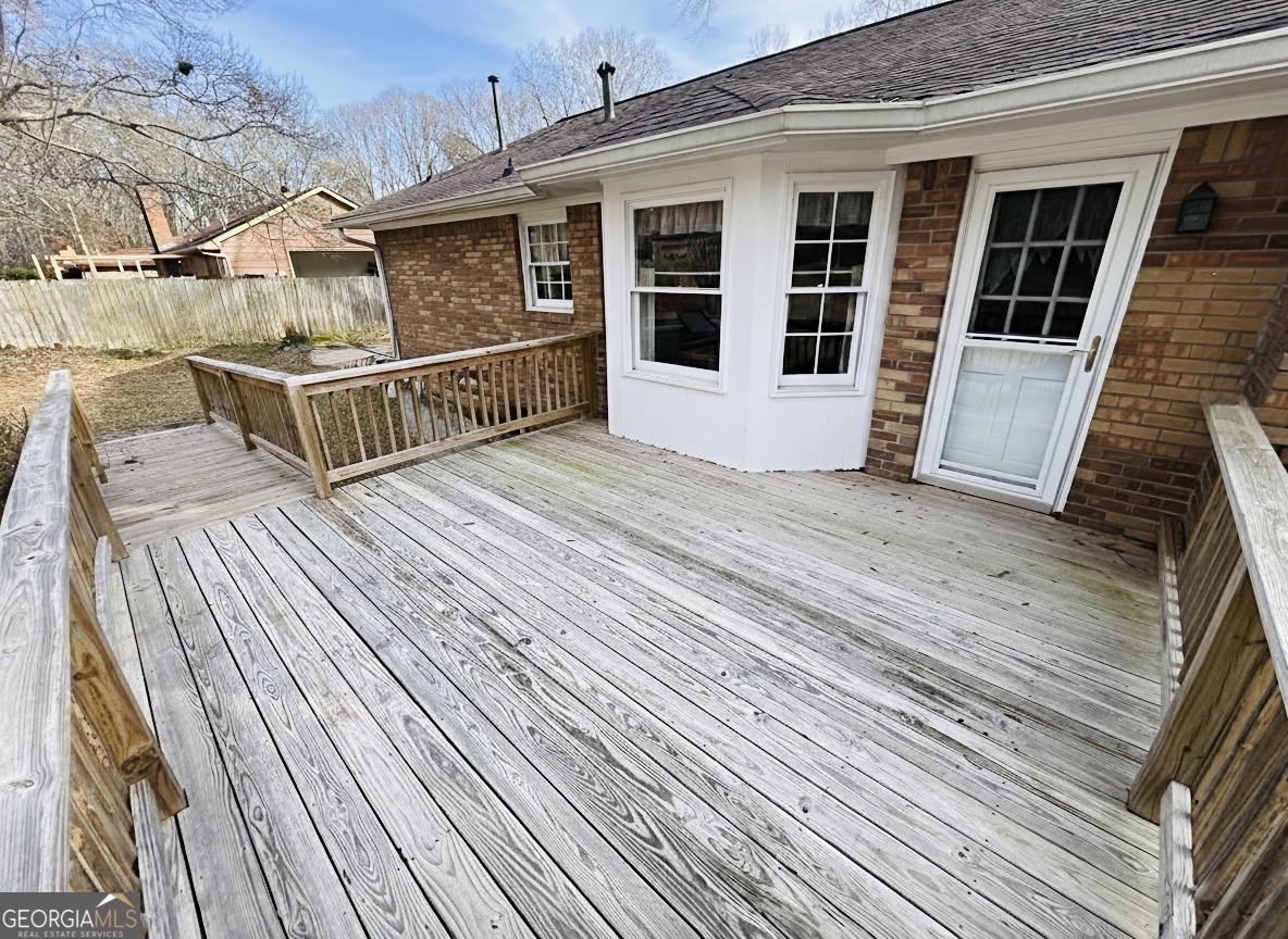 211 Clark Road Griffin, GA 30224 - Photo 17 of 25 a view of a house with wooden deck