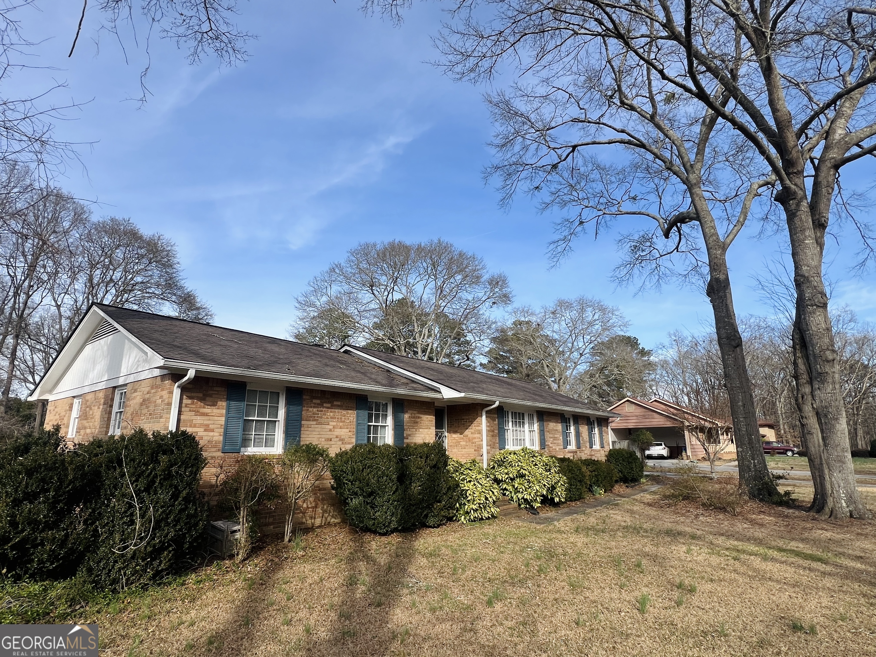 211 Clark Road Griffin, GA 30224 - Photo 2 of 25 a front view of a house with a yard covered in snow