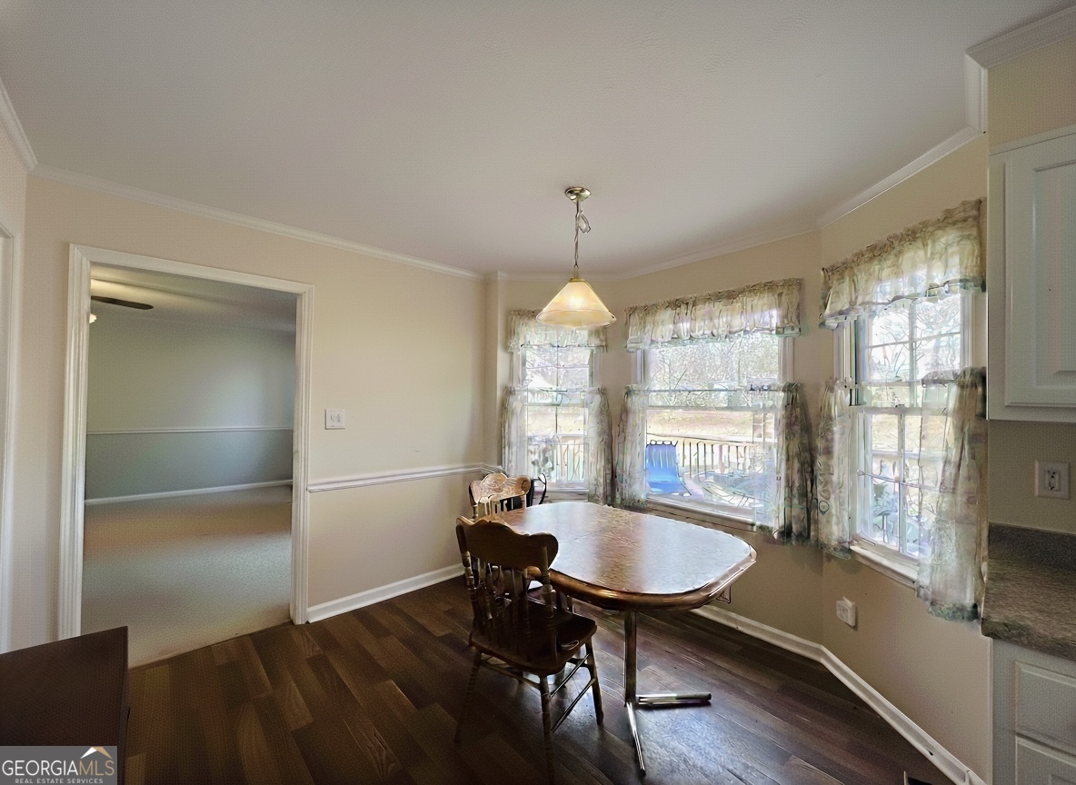 211 Clark Road Griffin, GA 30224 - Photo 6 of 25 a view of a dining room with furniture window and wooden floor