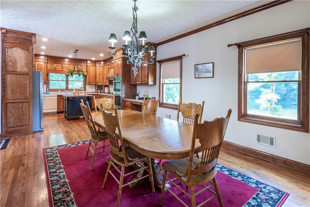 755 Harris Road Jasper, GA 30143 - Photo 17 of 54 a view of a dining room with furniture window and wooden floor