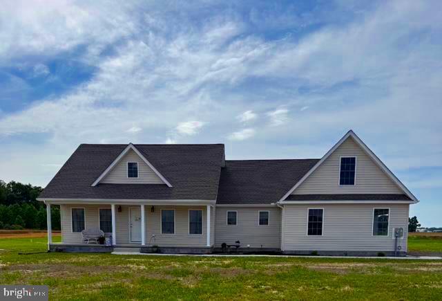 1 Old Sharptown Road Laurel, DE 19956 - Photo 1 of 8 a front view of a house with a garden