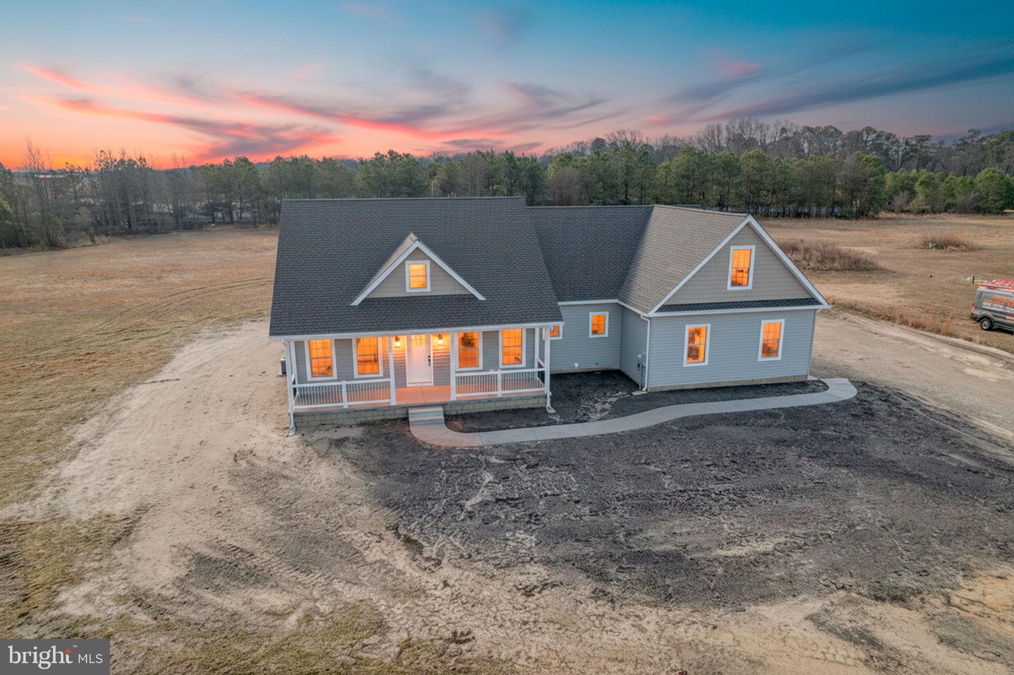 3150 Old Sharptown Road Laurel, DE 19956 - Photo 1 of 46 a view of a small house with a yard