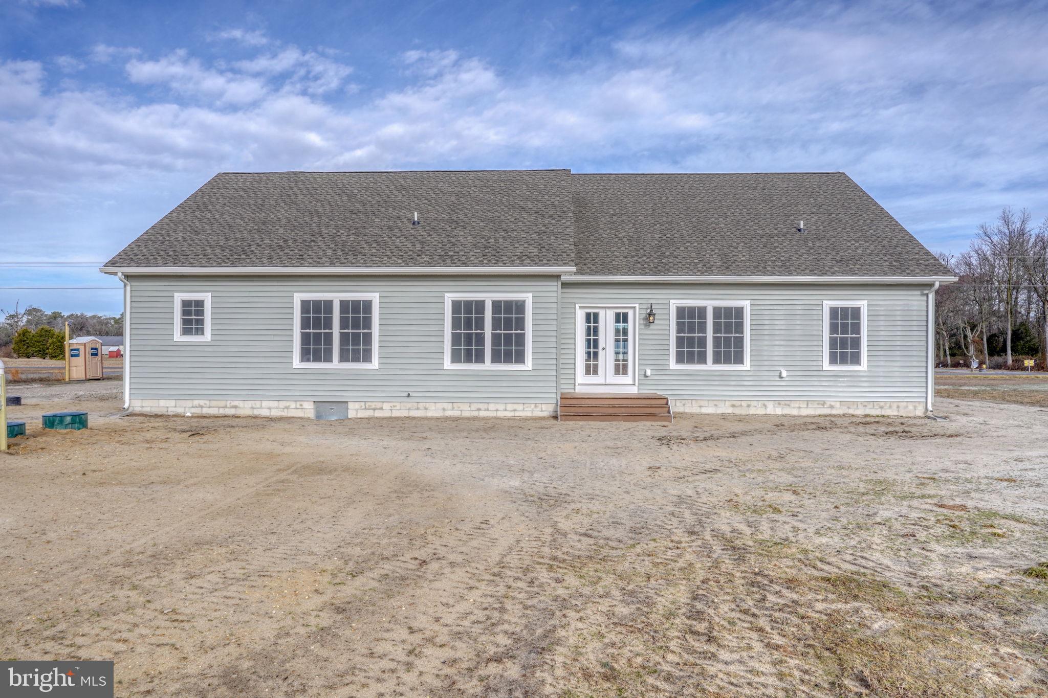 3150 Old Sharptown Road Laurel, DE 19956 - Photo 11 of 46 front view of a house with a dry yard