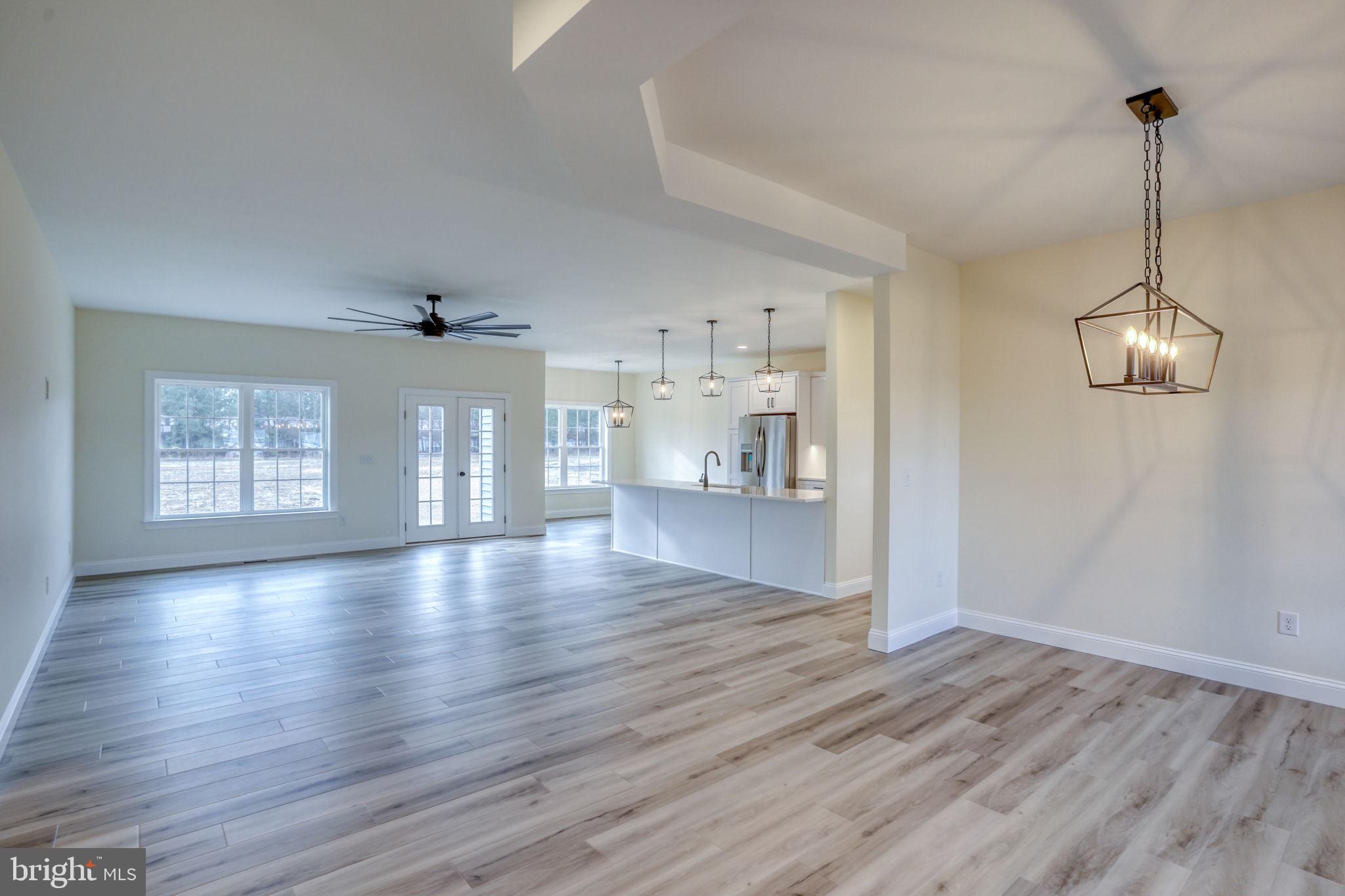 3150 Old Sharptown Road Laurel, DE 19956 - Photo 13 of 46 a view of empty room with wooden floor and window