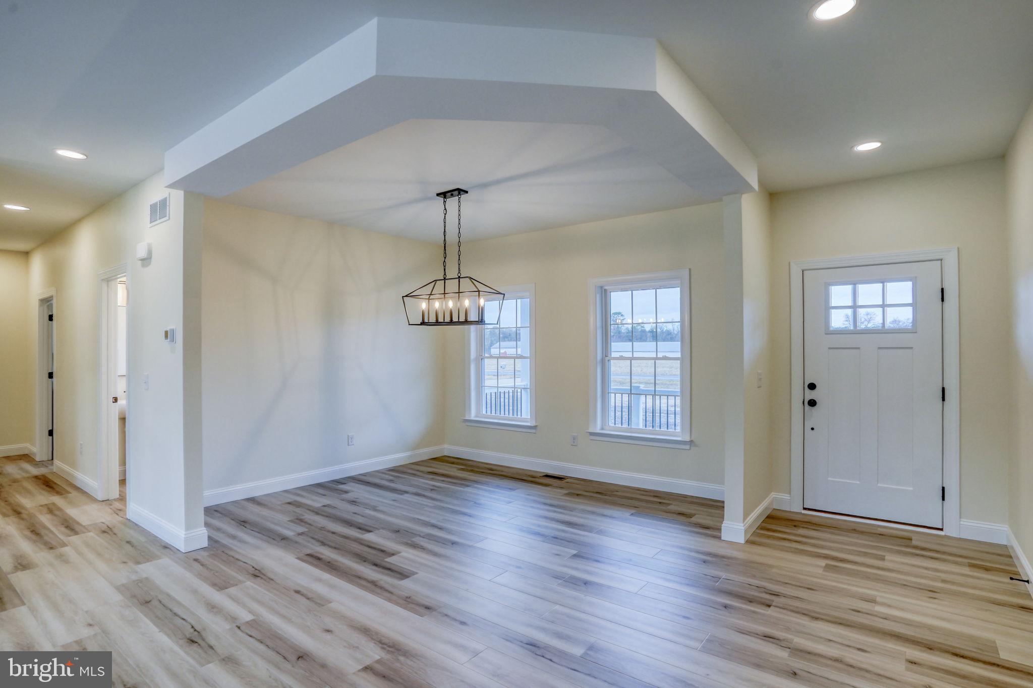 3150 Old Sharptown Road Laurel, DE 19956 - Photo 15 of 46 a view of an empty room with window and wooden floor