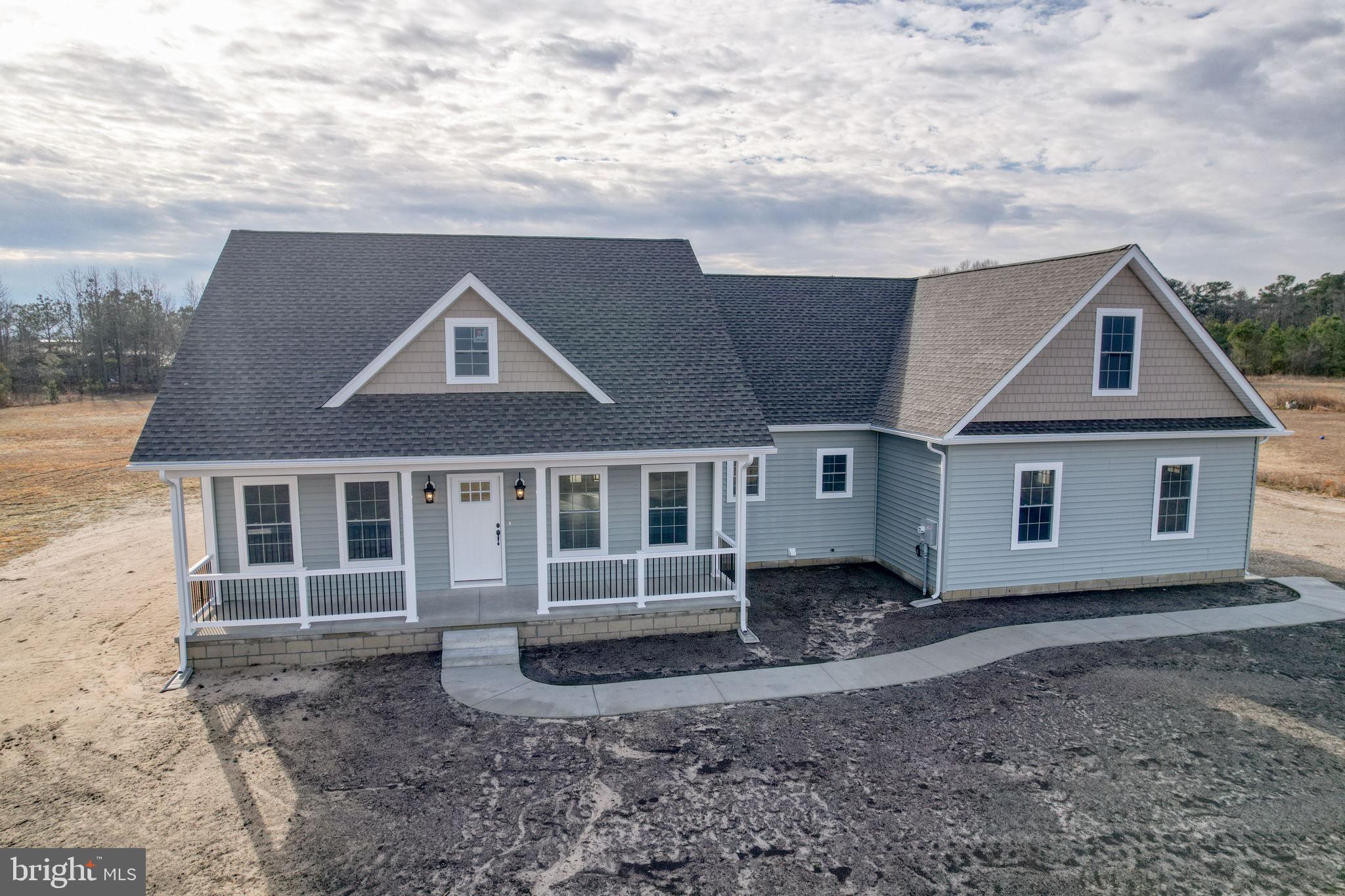 3150 Old Sharptown Road Laurel, DE 19956 - Photo 2 of 46 a front view of a house with a yard