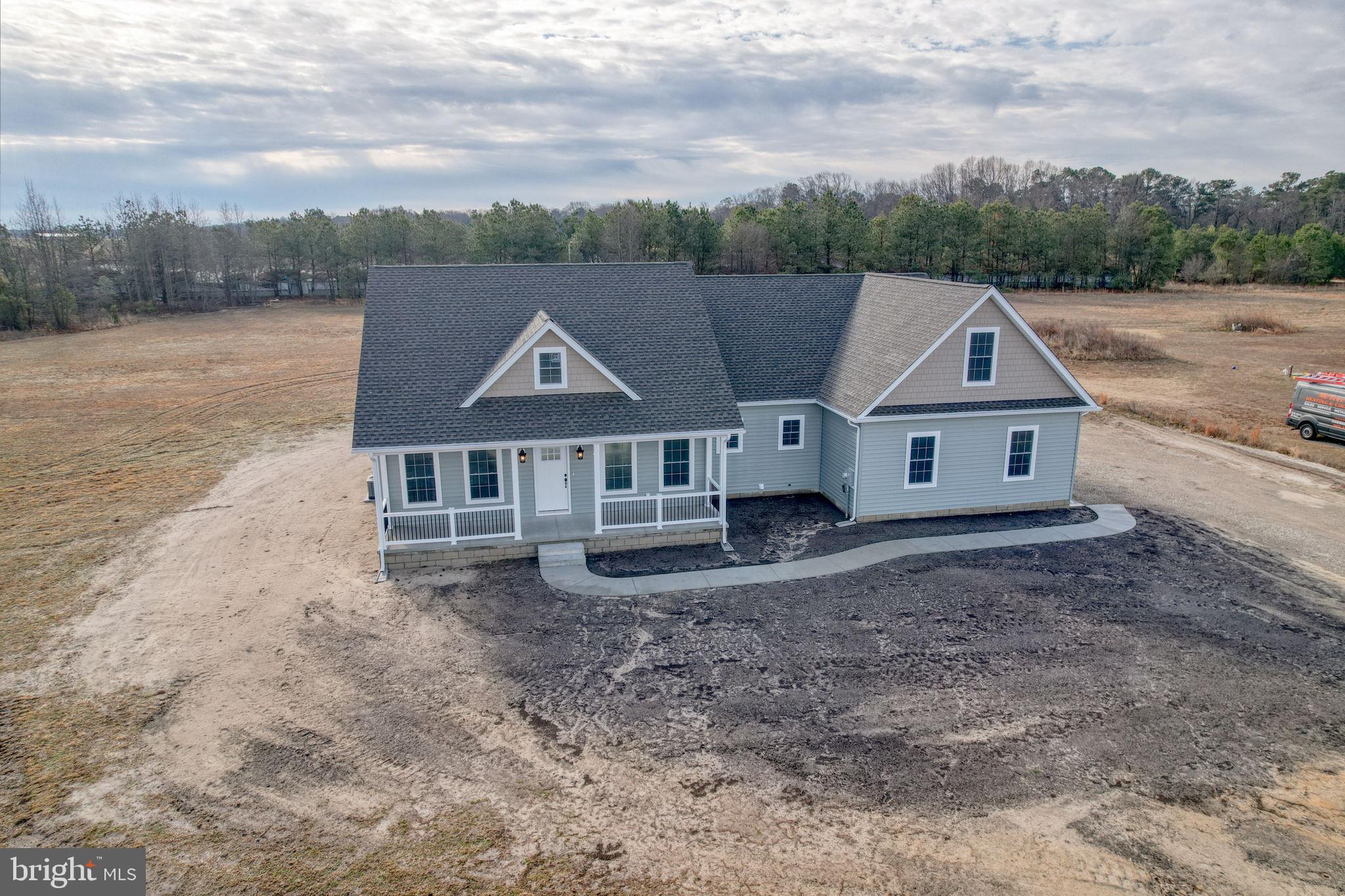 3150 Old Sharptown Road Laurel, DE 19956 - Photo 3 of 46 an aerial view of a house with a big yard