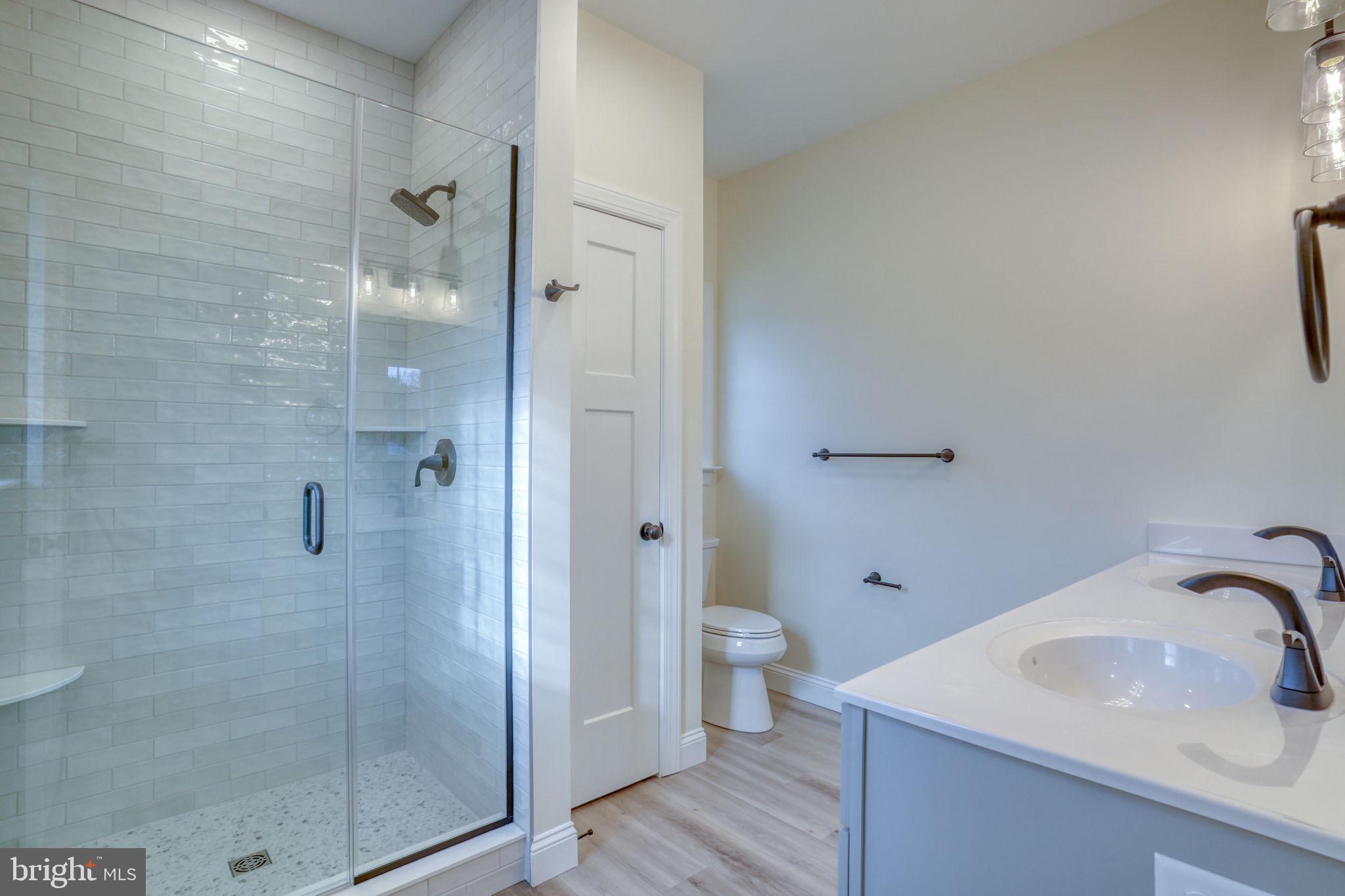 3150 Old Sharptown Road Laurel, DE 19956 - Photo 36 of 46 a bathroom with a sink toilet and shower