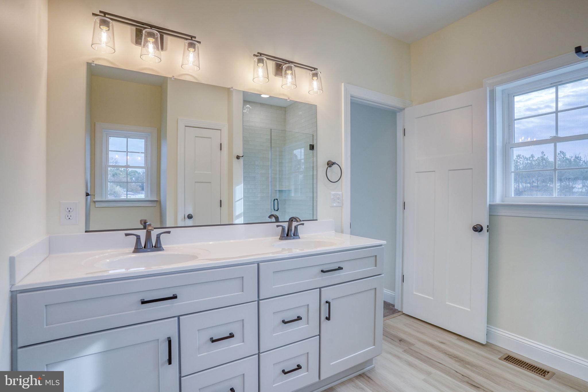 3150 Old Sharptown Road Laurel, DE 19956 - Photo 37 of 46 a bathroom with double sink and a mirror