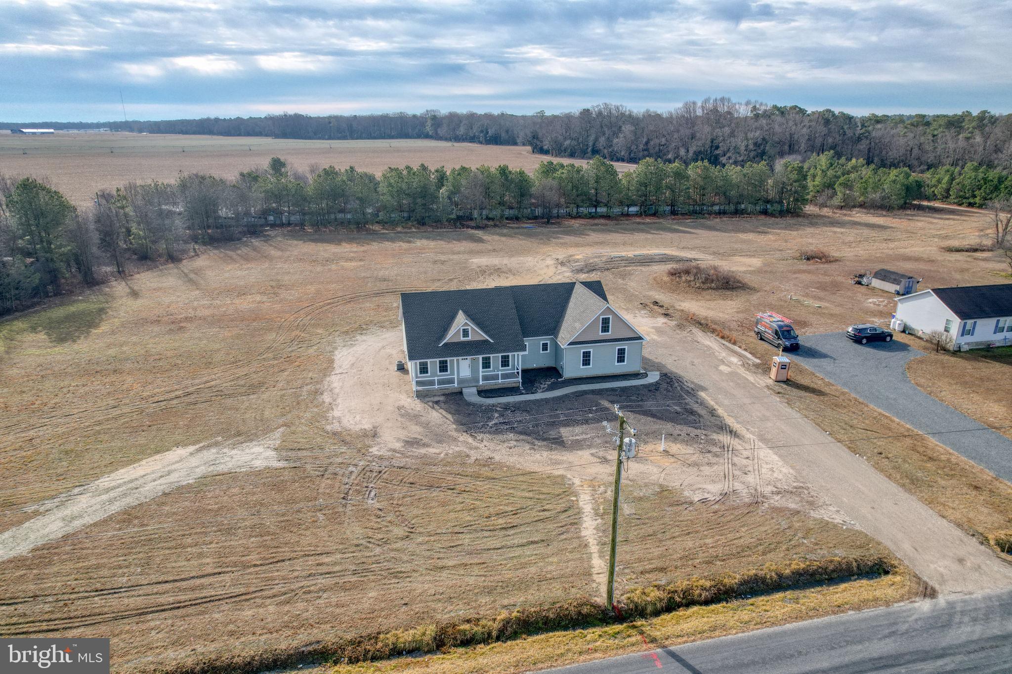 3150 Old Sharptown Road Laurel, DE 19956 - Photo 4 of 46 a view of a swimming pool with a yard