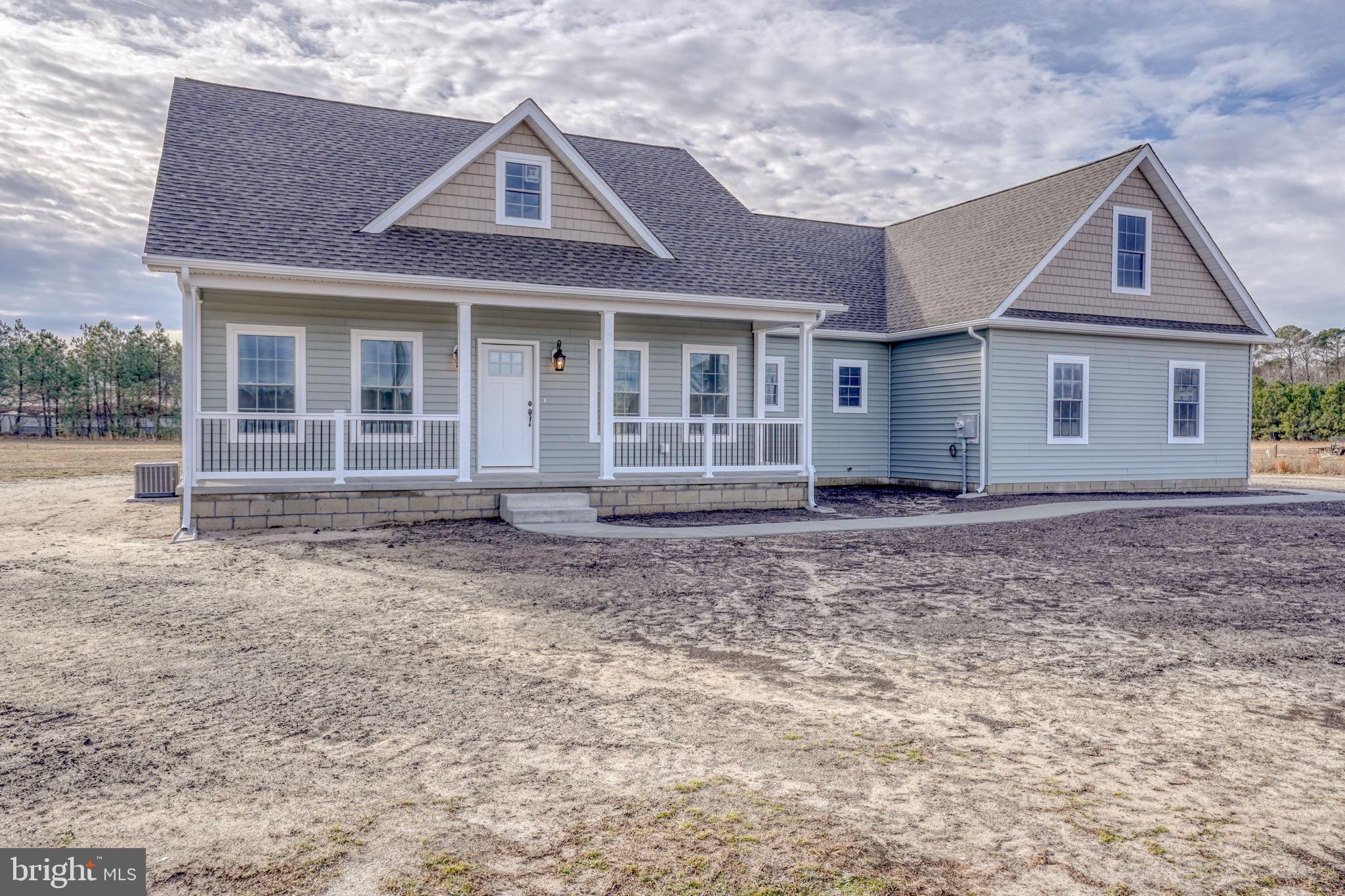 3150 Old Sharptown Road Laurel, DE 19956 - Photo 7 of 46 front view of a house with a yard