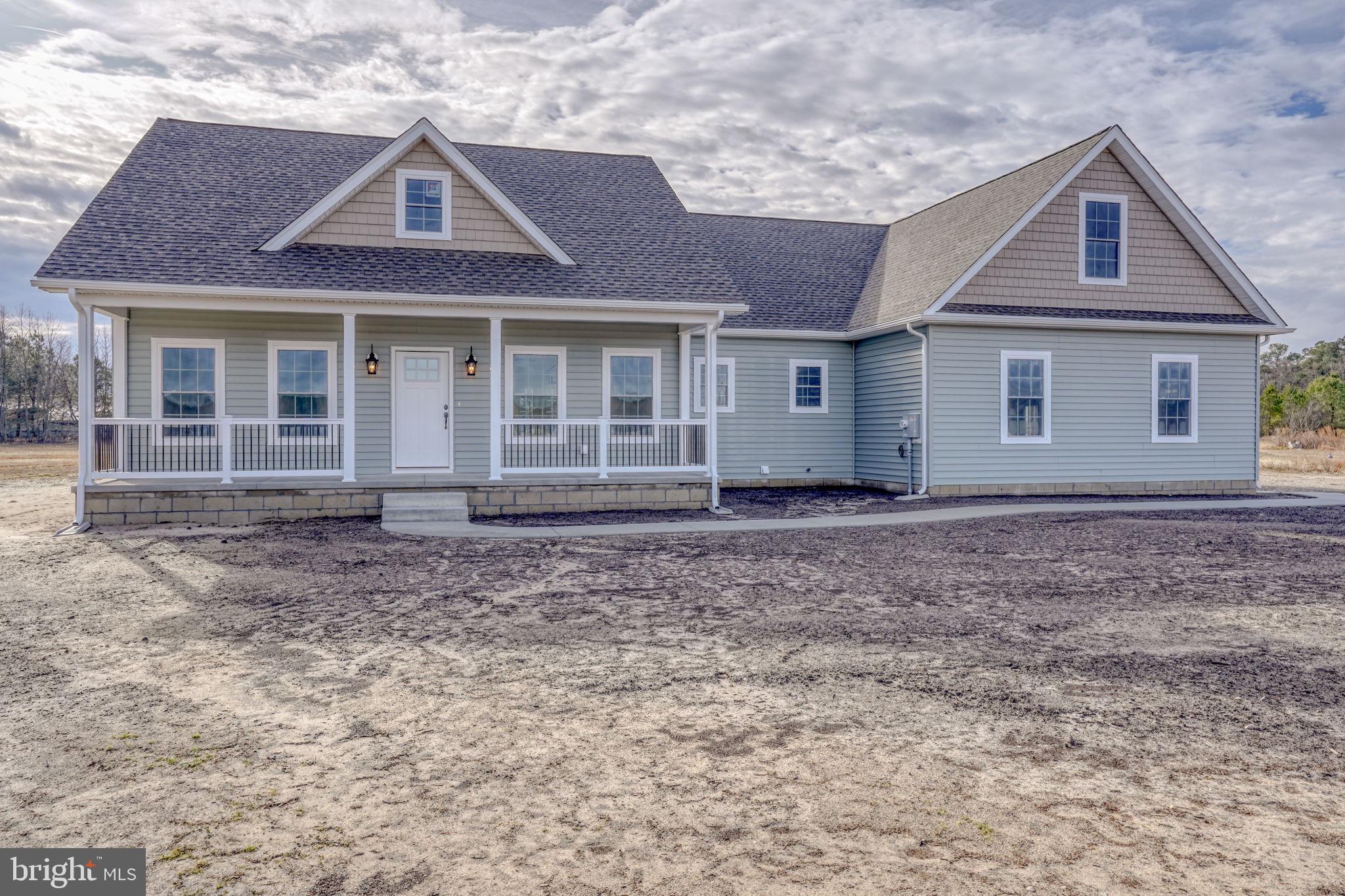 3150 Old Sharptown Road Laurel, DE 19956 - Photo 8 of 46 front view of a house with a yard