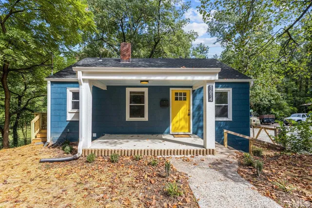 a front view of a house with a outdoor space