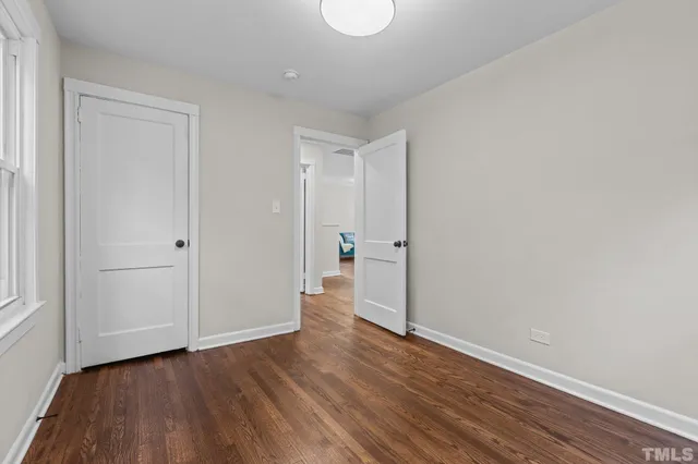 a view of wooden floor in an empty room