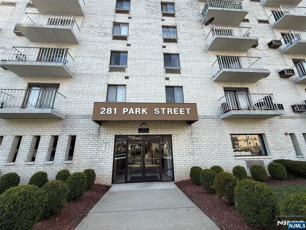 281 Park Street, Unit 3B Hackensack, NJ 07601 - Photo 11 of 11 a front view of a brick building with many windows