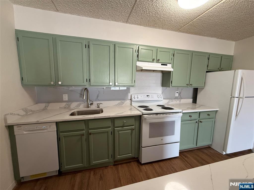 281 Park Street, Unit 3B Hackensack, NJ 07601 - Photo 3 of 11 a kitchen with a sink and a stove top oven
