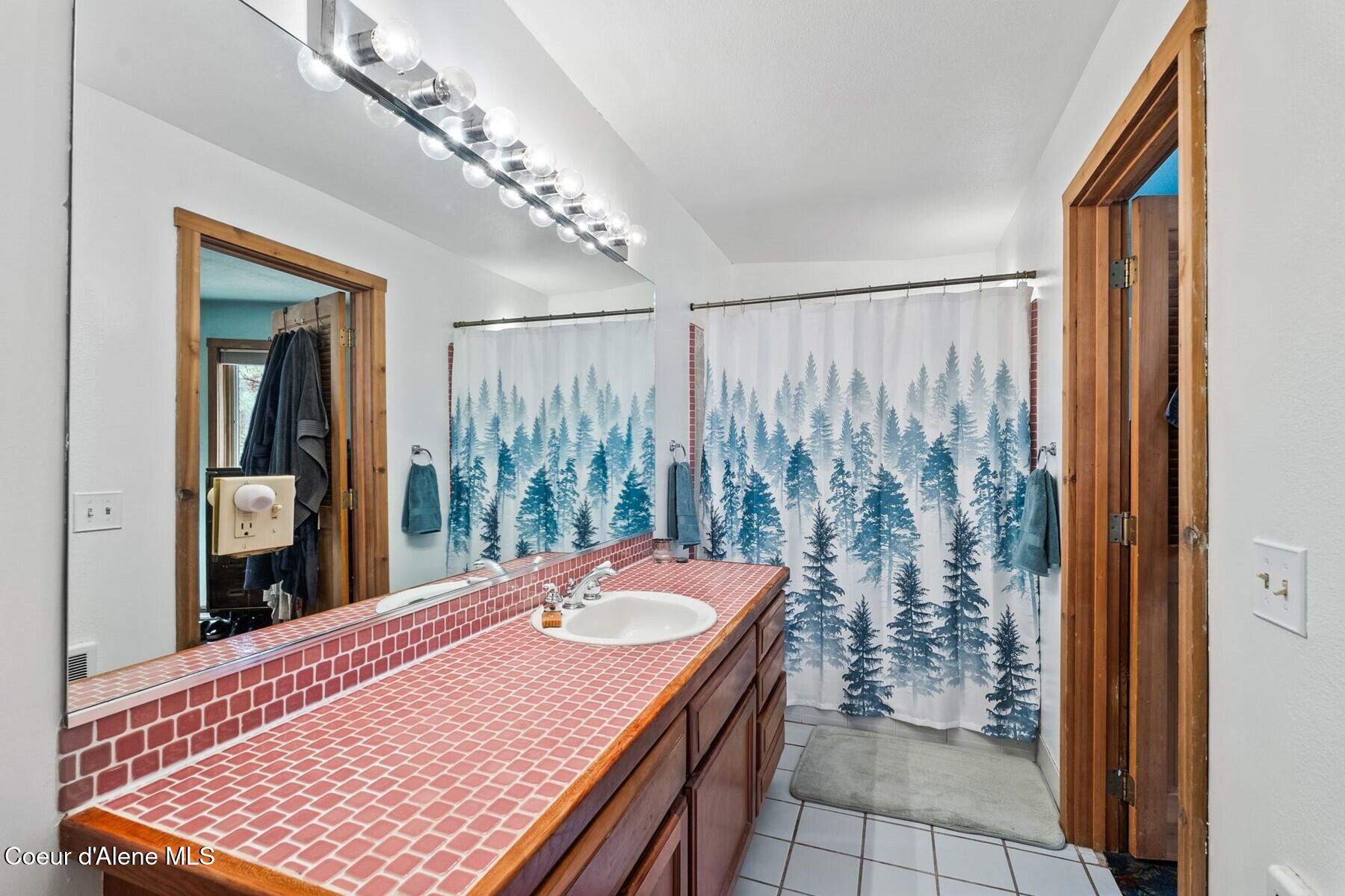 4057 Jewel Lake Road Sagle, ID 83860 - Photo 25 of 52 1st floor bathroom