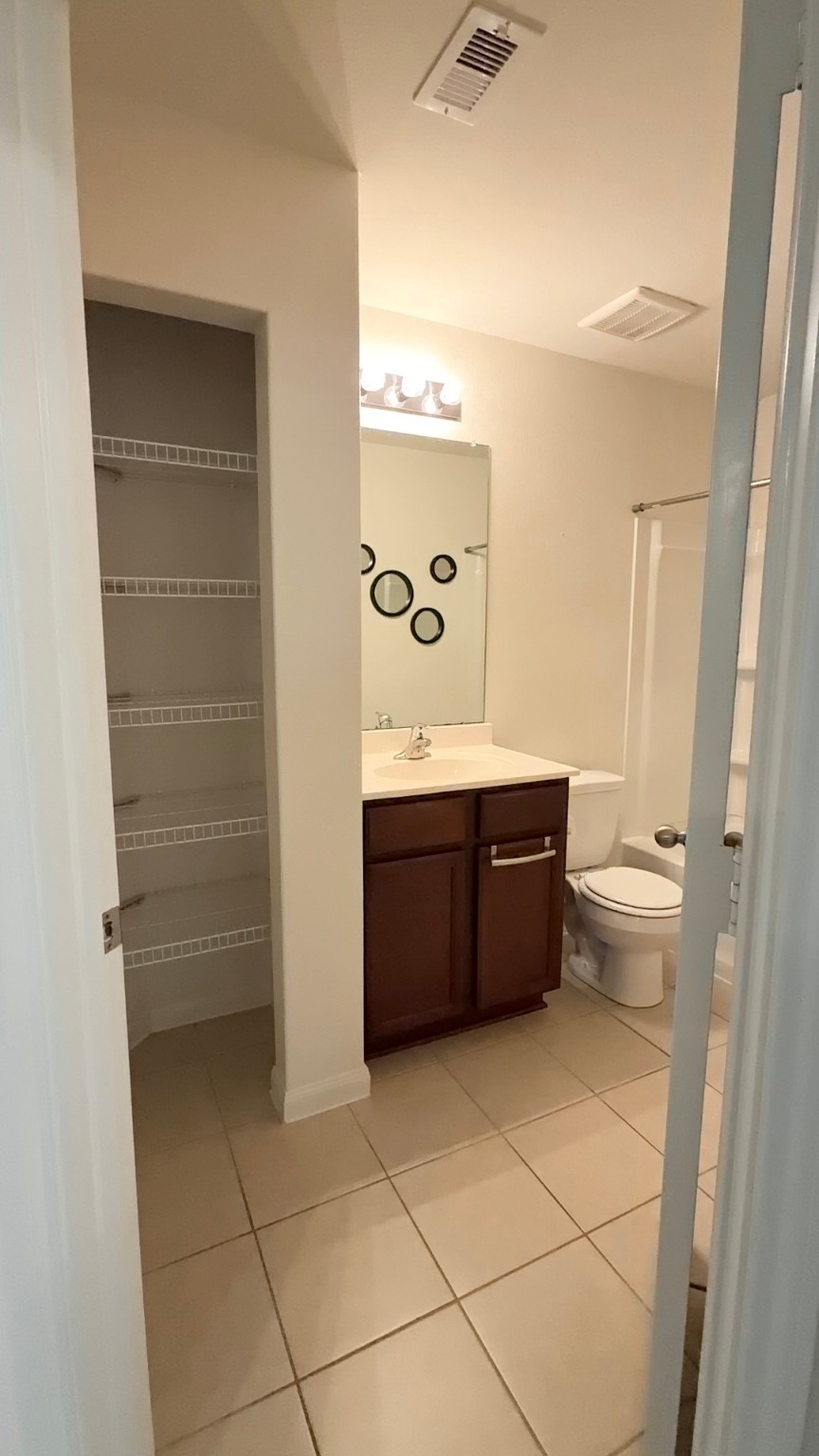 22418 Threefold Ridge Drive Hockley, TX 77447 - Photo 16 of 19 a room with a toilet sink and mirror