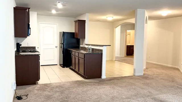 en empty room with wooden floor