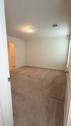 a bathroom with a sink vanity and mirror