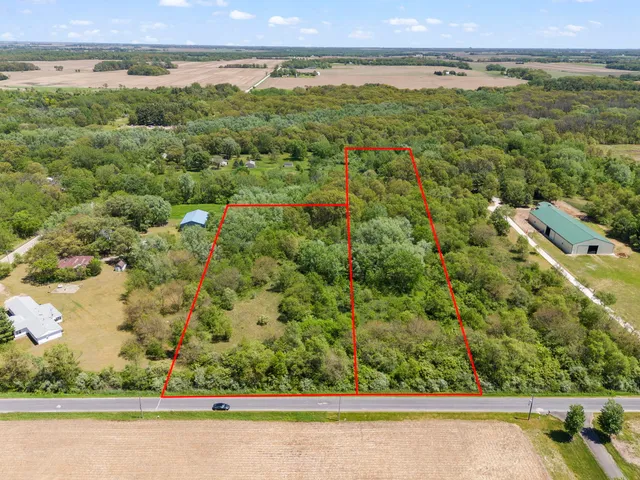 an aerial view of a yard with houses