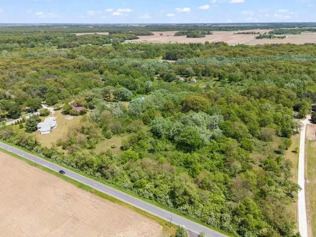 a view of a green field with a yard