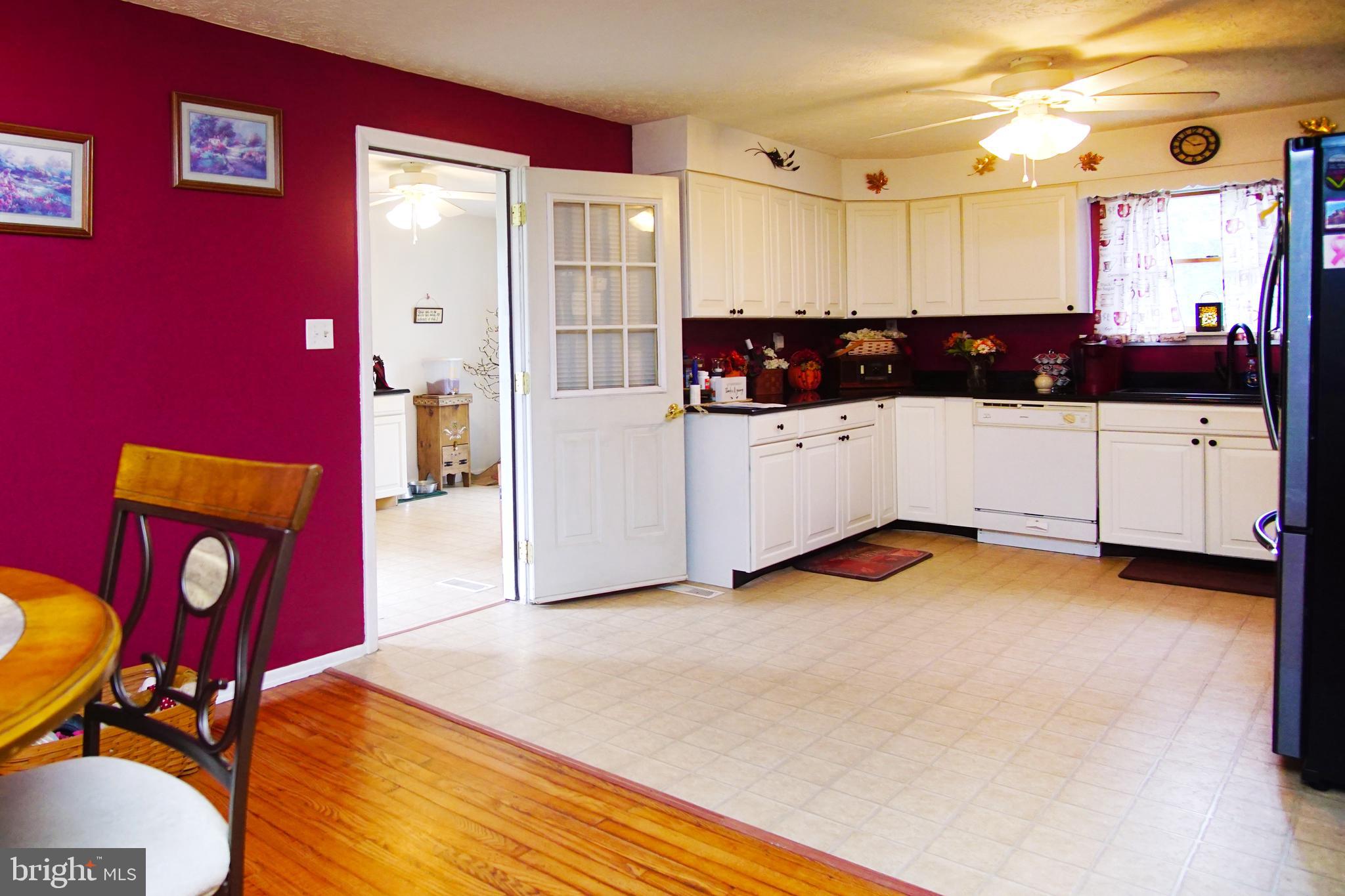 12806 Winchester Road Southwest Cumberland, MD 21502 - Photo 15 of 54 Dining room looking into kitchen and laundry
