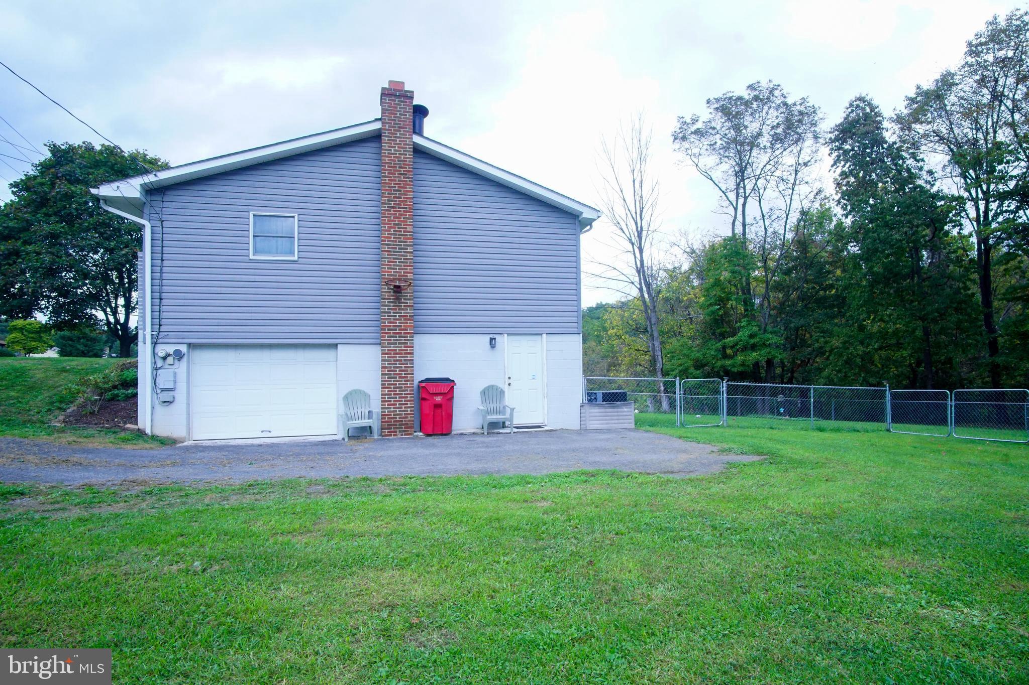 12806 Winchester Road Southwest Cumberland, MD 21502 - Photo 46 of 54 Side view showing garage and fence...