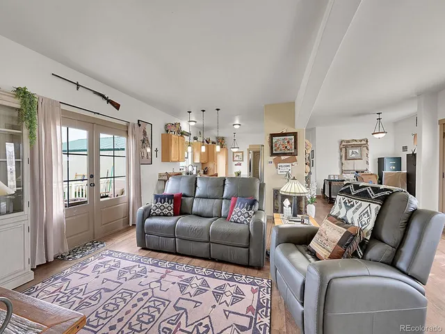 a view of a swimming pool with a lawn chairs under an umbrella